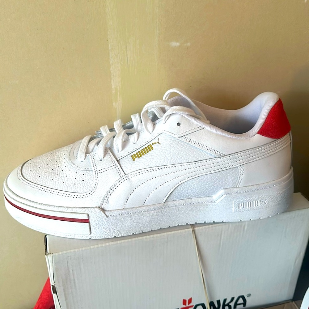 Red, white and gold Puma leather shoes